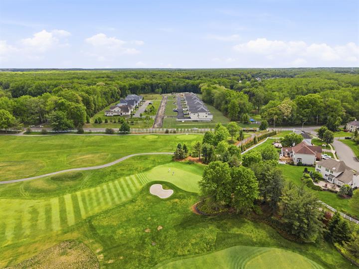 Aerial view over the fairway toward the townhomes