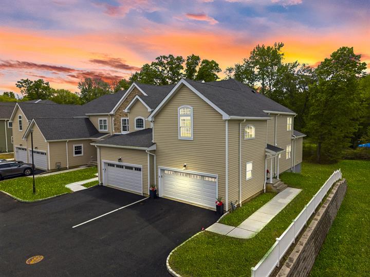 Townhome exterior at twilight
