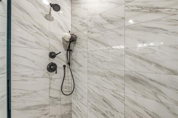 Walk-in shower with marble-look tile